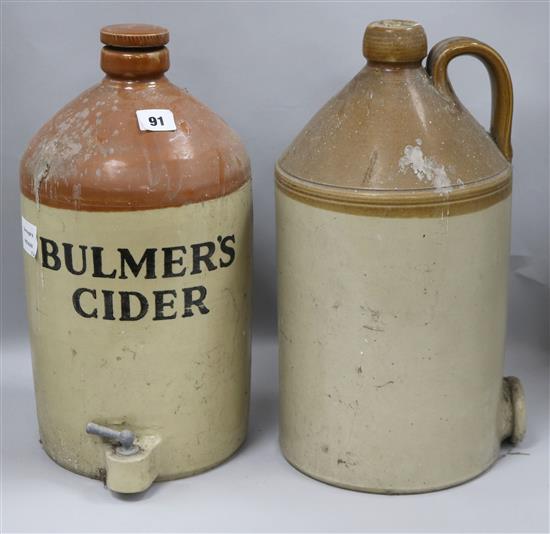 A Bulmers cider stoneware jar with tap and another similar